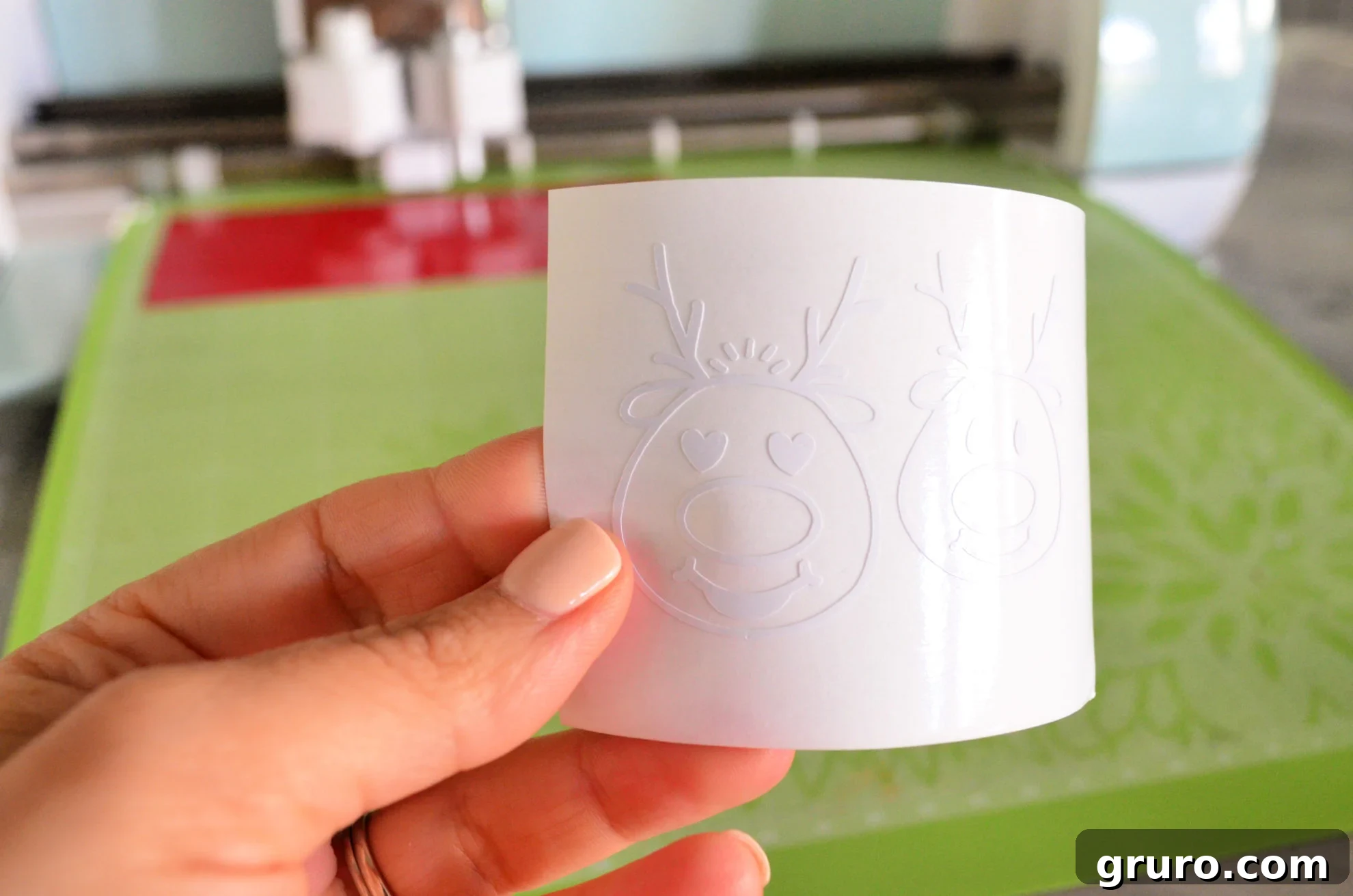Weeding white reindeer vinyl cutouts for Jingle Juice Wine Glasses