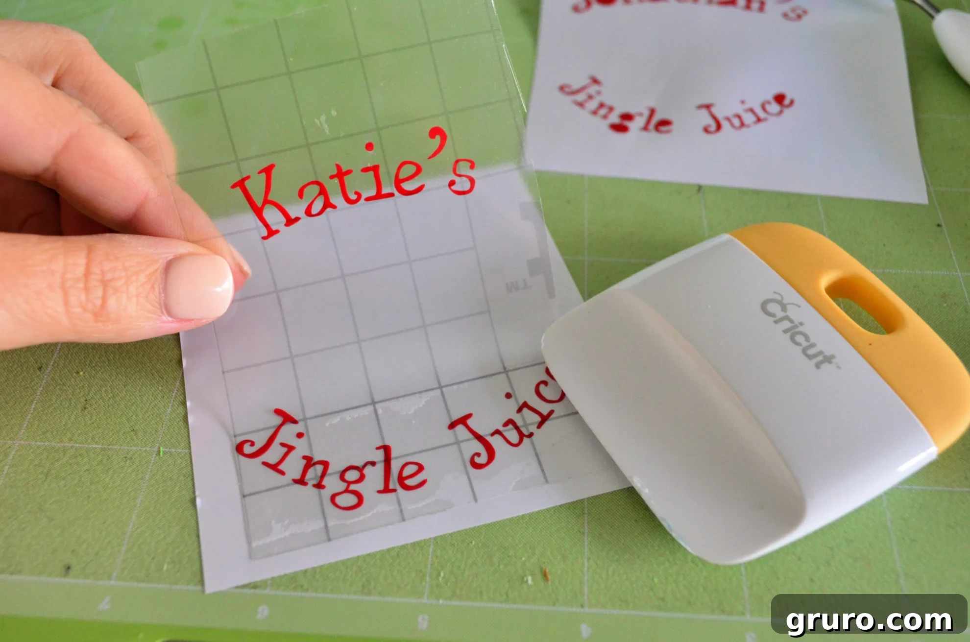 Applying transfer tape to Jingle Juice personalized text vinyl