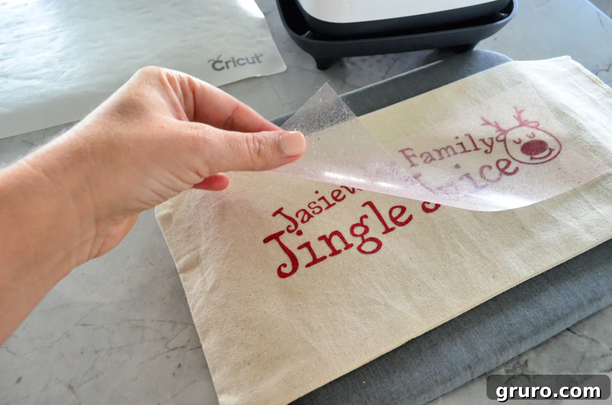 Peeling off Iron-On Vinyl from DIY Personalized Jingle Juice Wine Bag