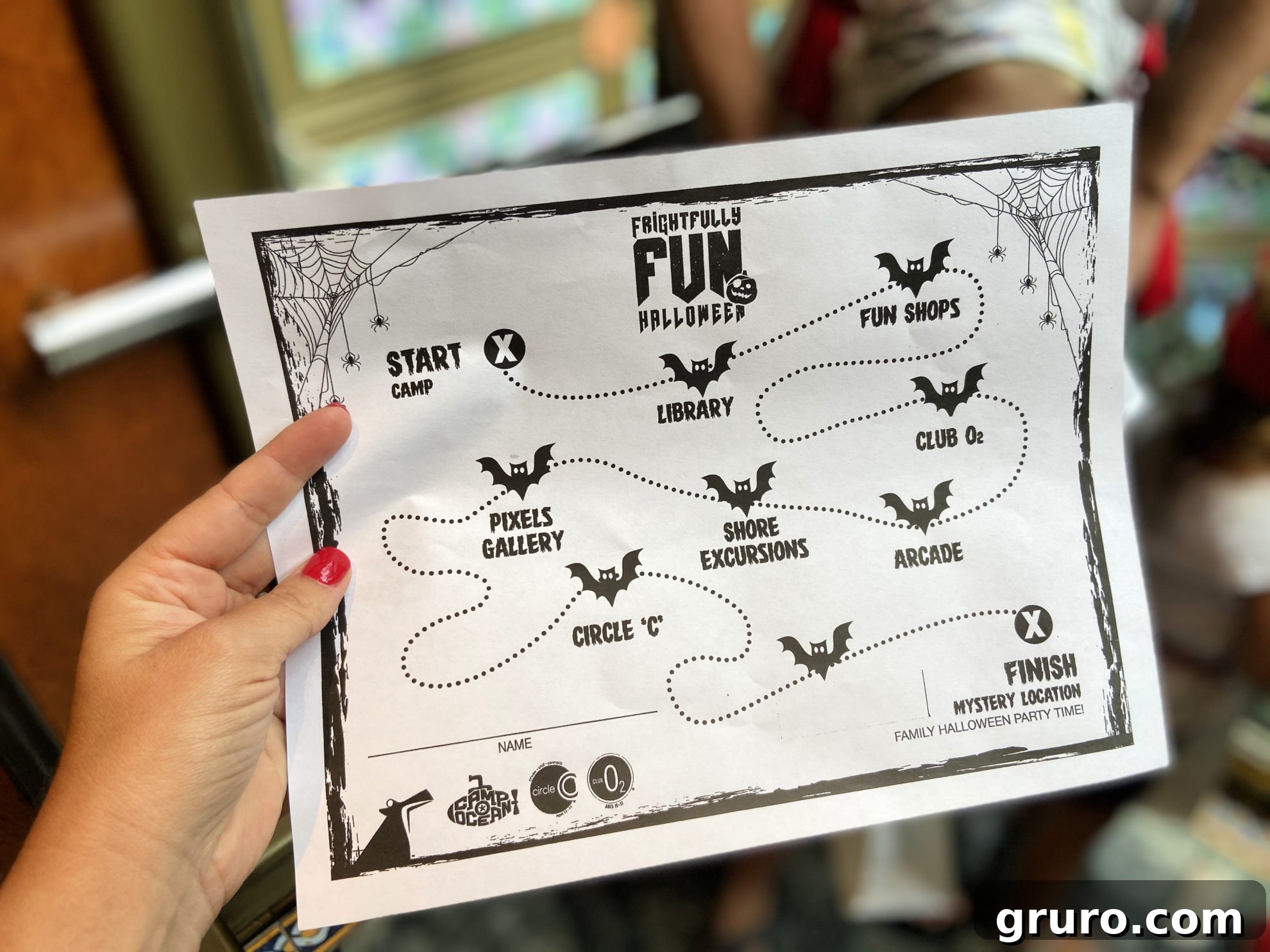 Close-up of a Carnival Cruise 'Frightfully Fun Trick-or-Treat Map' showing locations for collecting candy.
