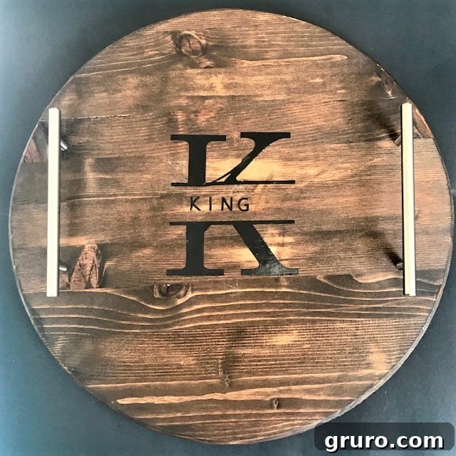 A beautiful personalized wood serving tray, customized with a family name using a Cricut machine.
