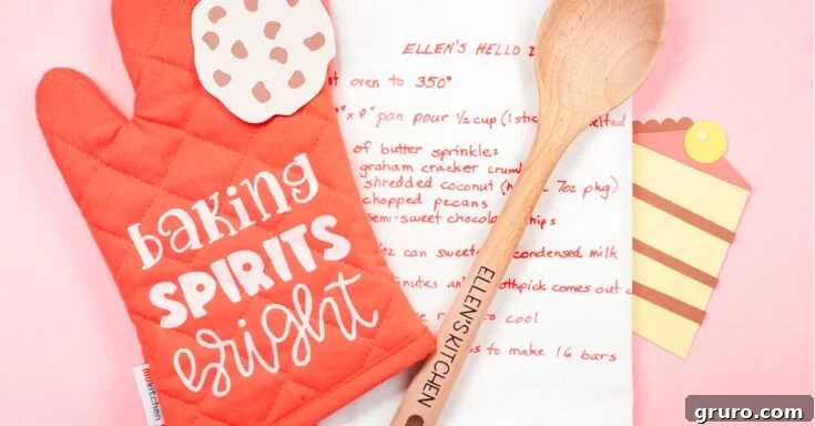 A personalized Christmas baking set including an oven mitt, towel with recipe, and custom spoon, made with Cricut iron-on vinyl.