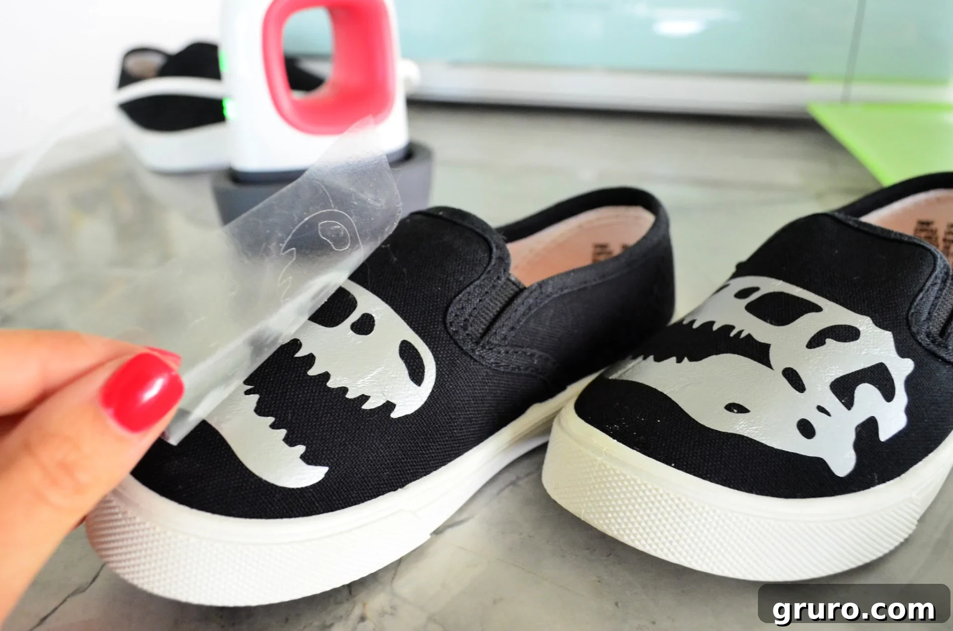 Effortlessly peeling off transfer tape from Iron-On Vinyl on shoes