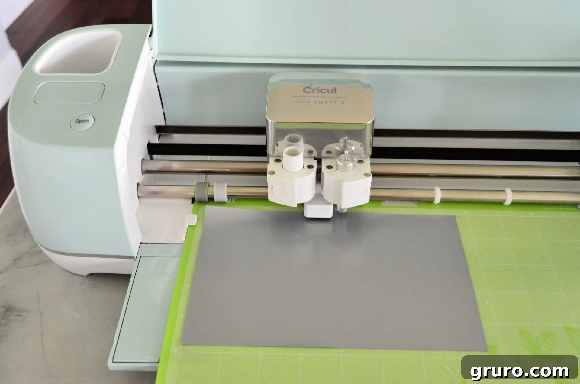 Cricut Explore Air 2 in Mint Green preparing to cut Iron-On Vinyl