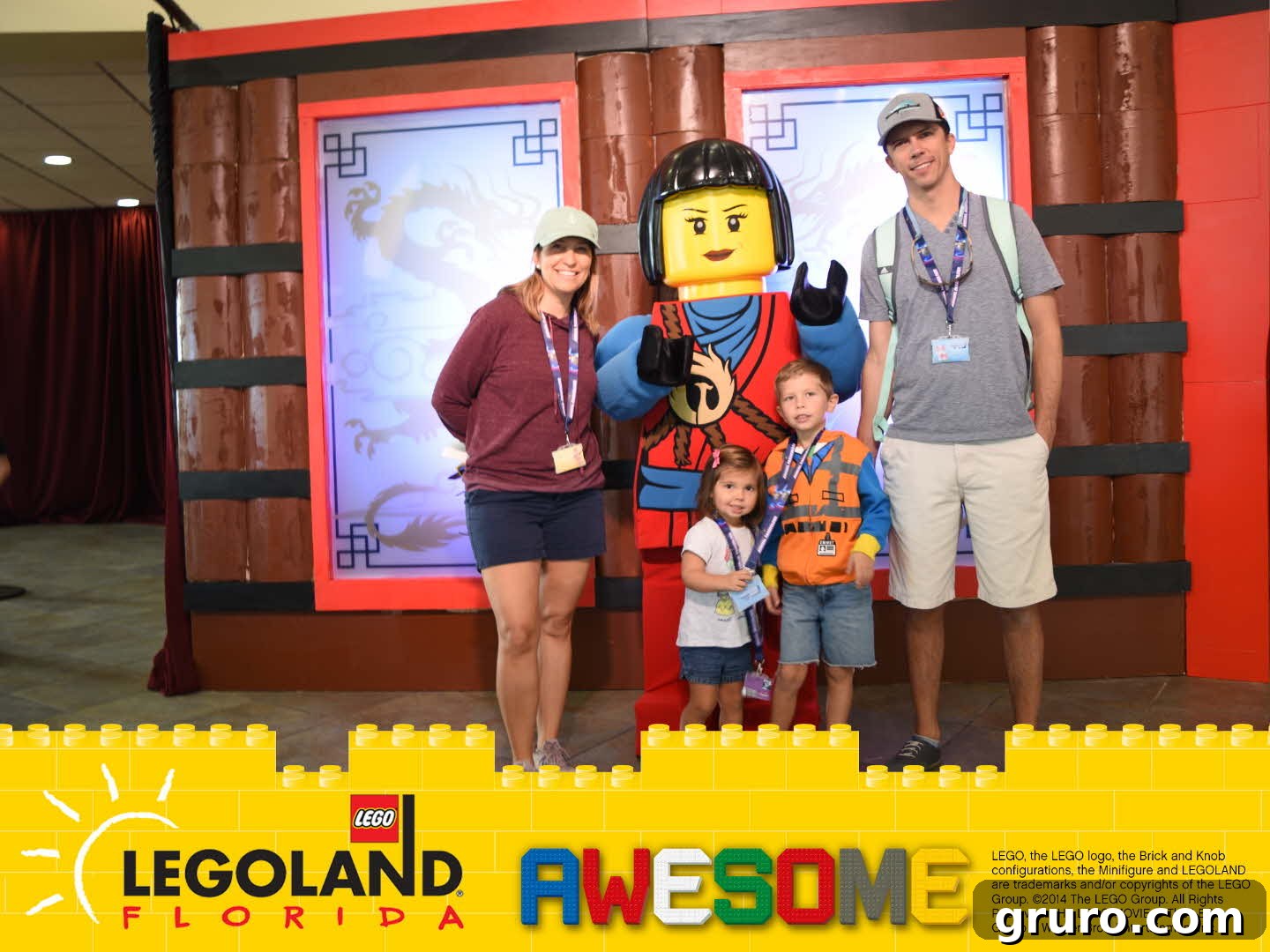 Family with Ninjago Character and legoland florida frame around photo.