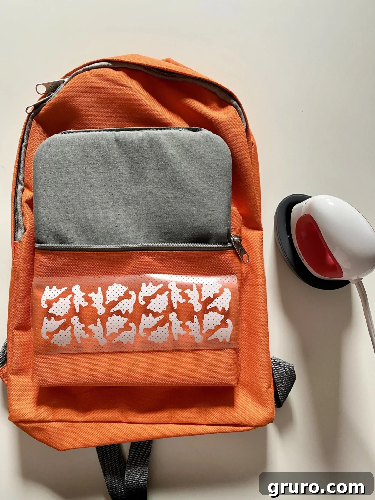 Dinosaur backpack with a large iron-on vinyl design