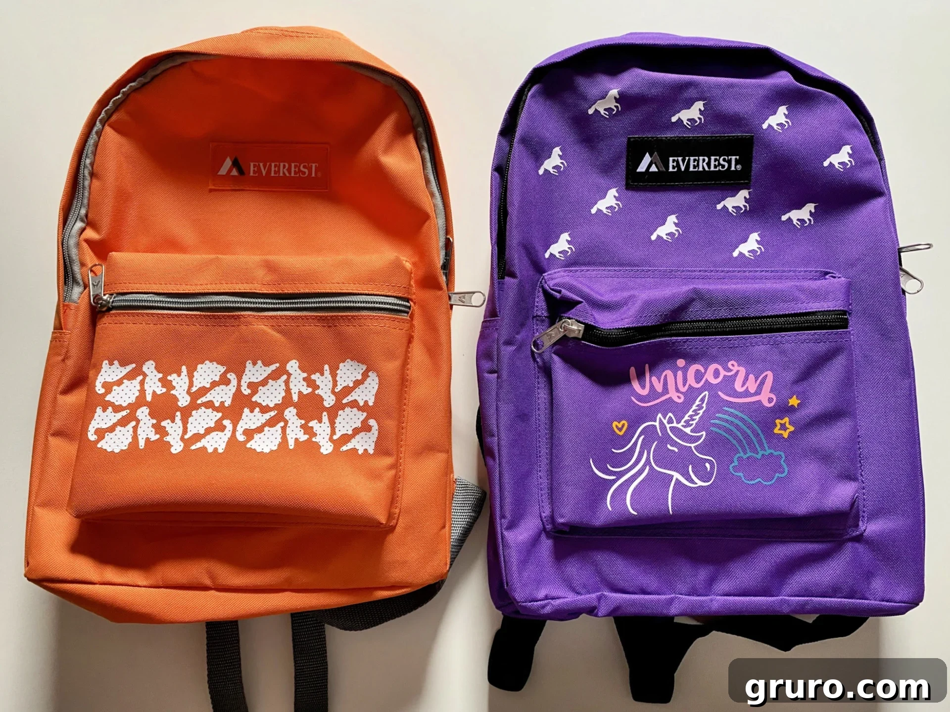 Two customized backpacks, one unicorn and one dinosaur design