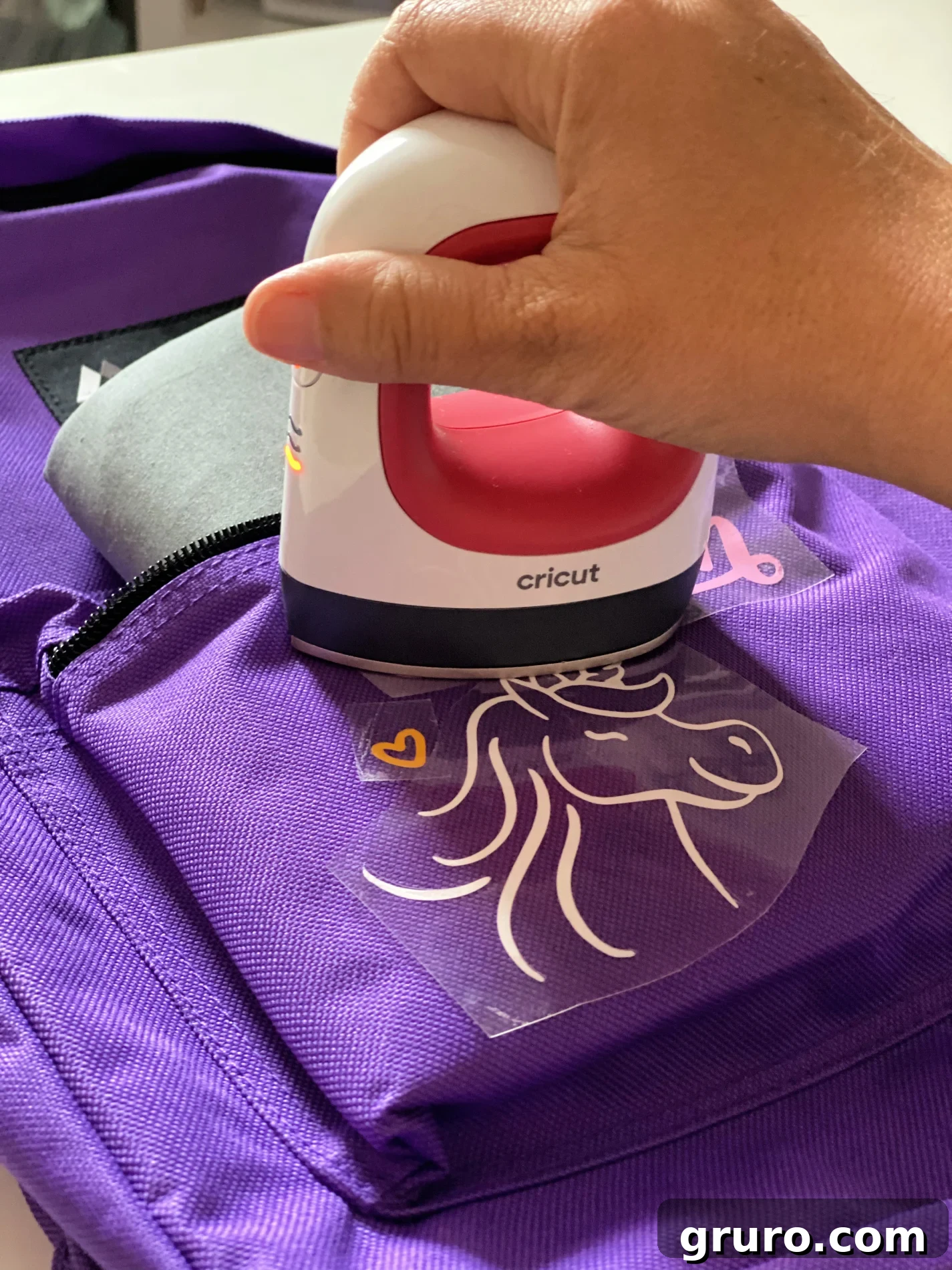 Applying the first layer of unicorn design with Cricut EasyPress Mini
