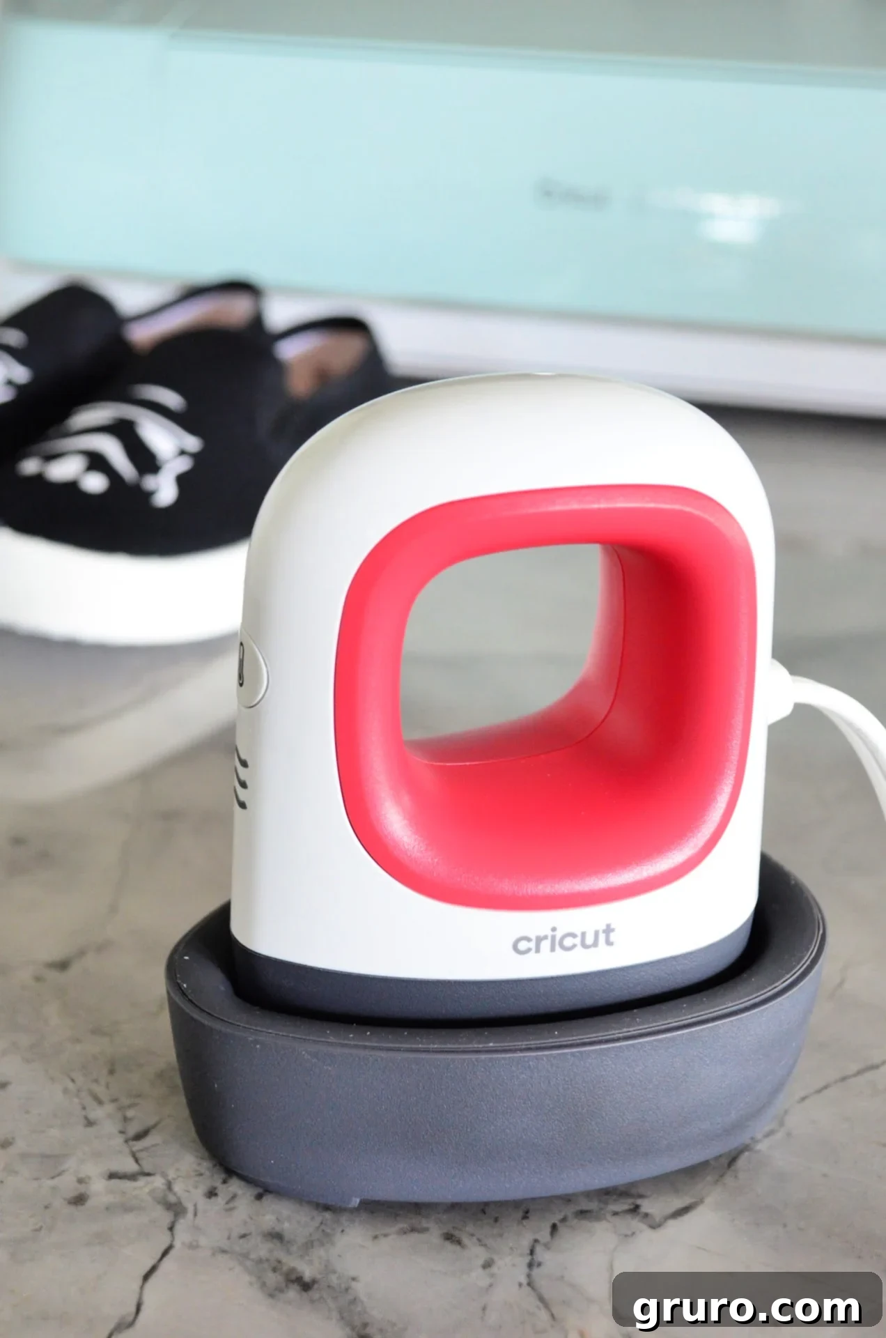 Cricut EasyPress Mini sitting next to a pair of custom Stormtrooper shoes, highlighting its use in the DIY project.