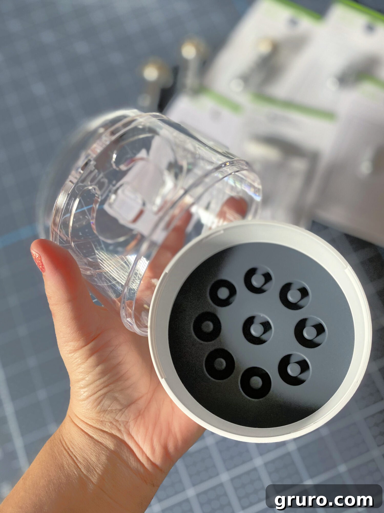 The Cricut Tool Organizer demonstrating its compact size in a hand.
