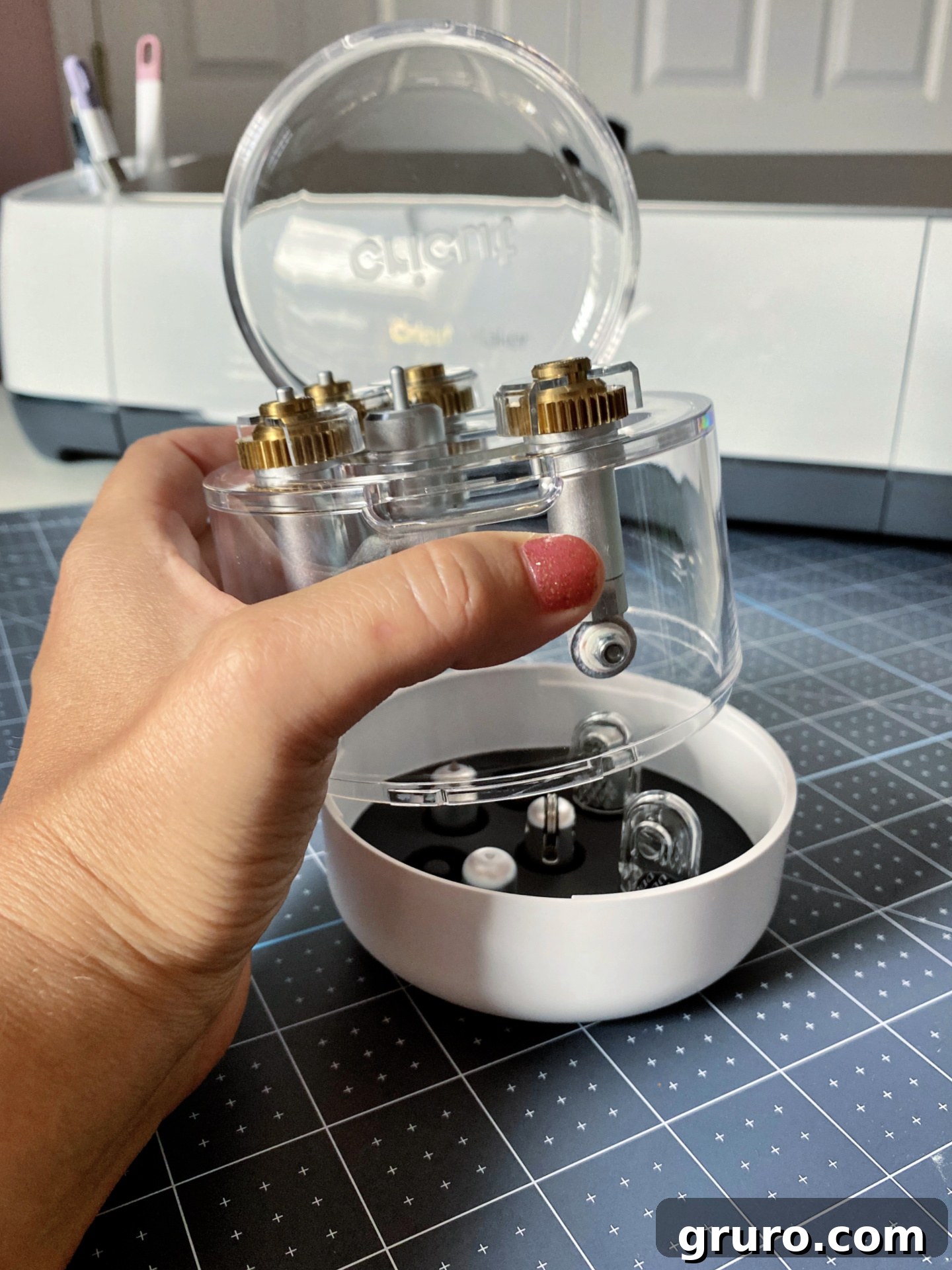Opening the machine tool organizer to access tools.