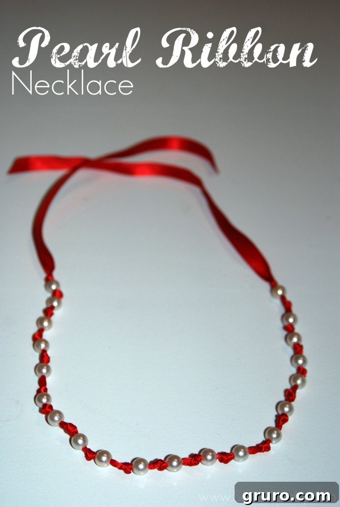 Ribbon Pearl Necklace 13 Beautiful handmade pearl ribbon necklace elegantly displayed on a white background