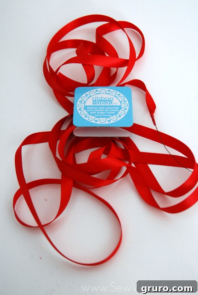 Ribbon Pearl Necklace 2 Detailed view of the integrated wire needle on Ribbon to Bead, showing its flexibility