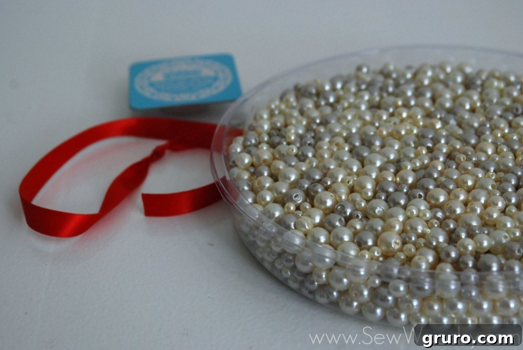 Ribbon Pearl Necklace 3 Person unwinding Ribbon to Bead from the spool, preparing for beading
