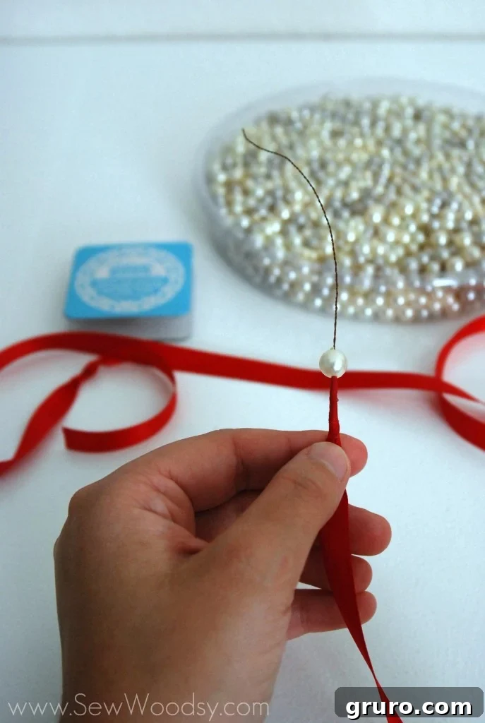 Ribbon Pearl Necklace 4 Large tub of assorted pearl beads from a craft store, ready for crafting