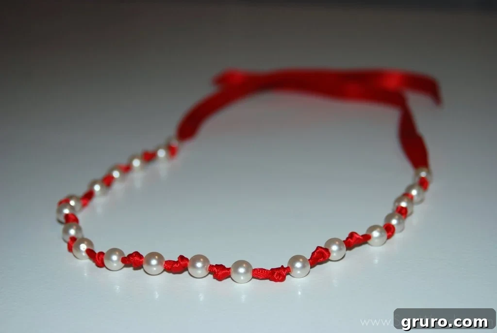 Ribbon Pearl Necklace 12 Finished DIY pearl ribbon necklace elegantly displayed, showcasing the pearls and ribbon