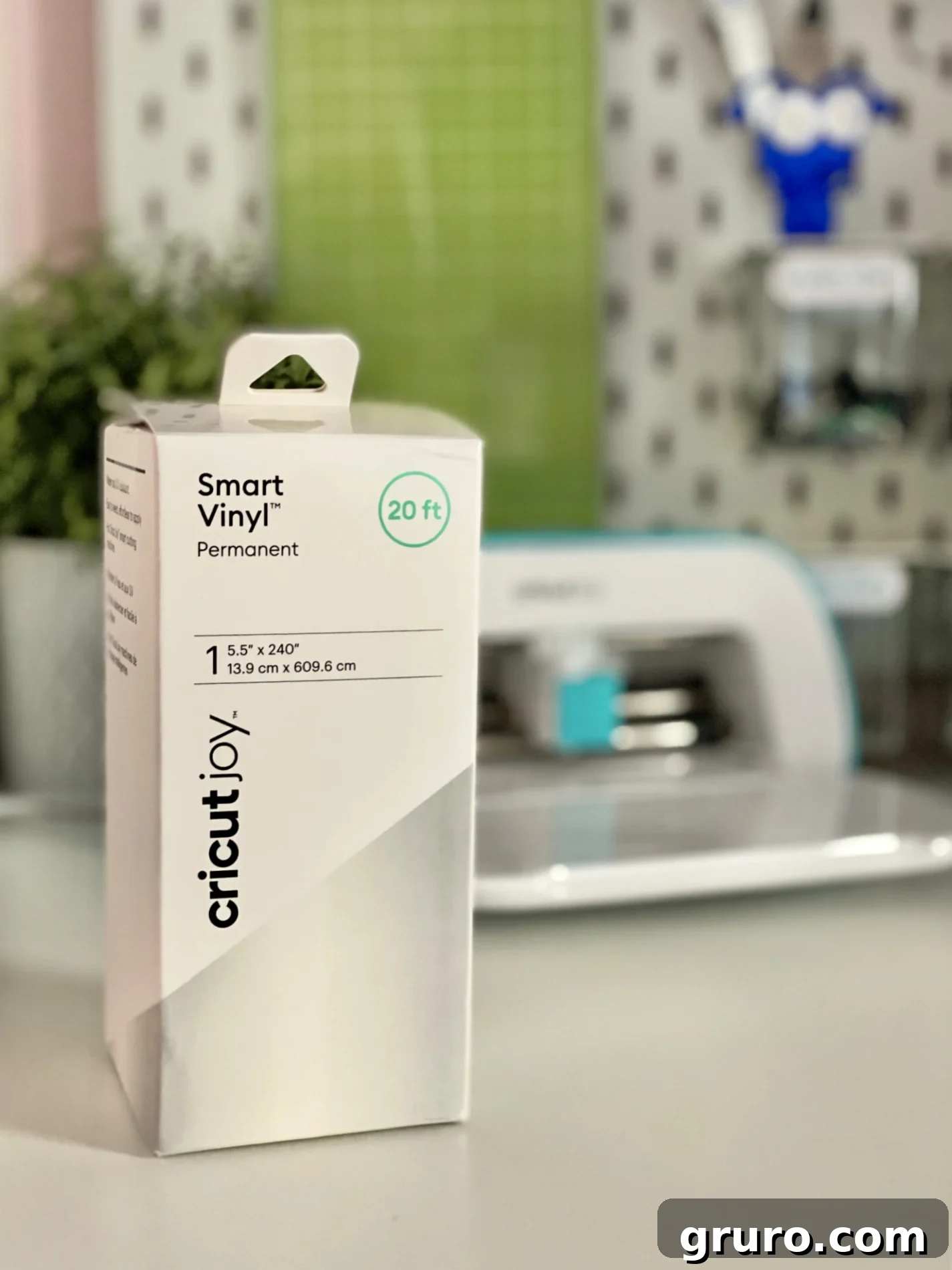 White box of Smart Vinyl sitting on desk with Cricut Joy in the background, ready for a crafting session.