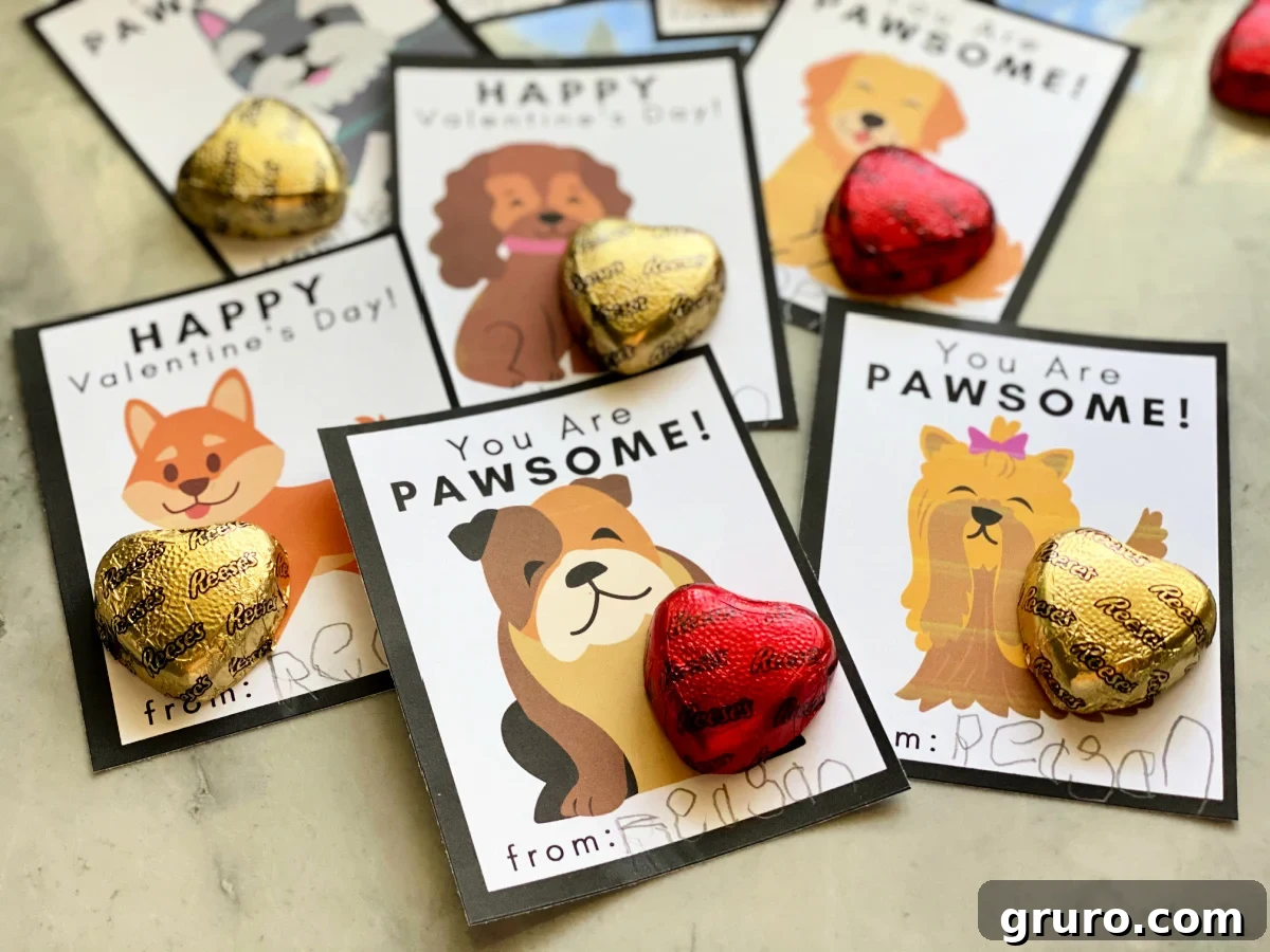 A close-up view of several Doggie Valentine Cards, each thoughtfully adorned with a small, heart-shaped chocolate candy, ready to be gifted.