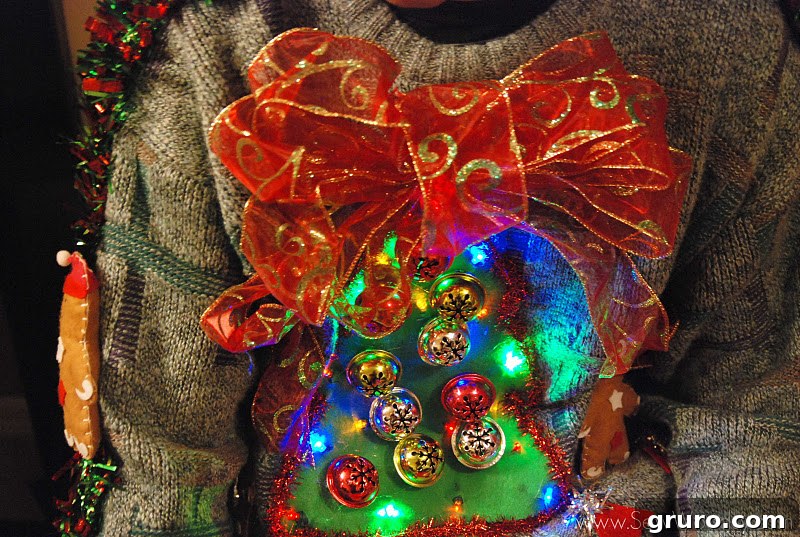 The author using a Bowdabra to create decorative bows for her sweater.