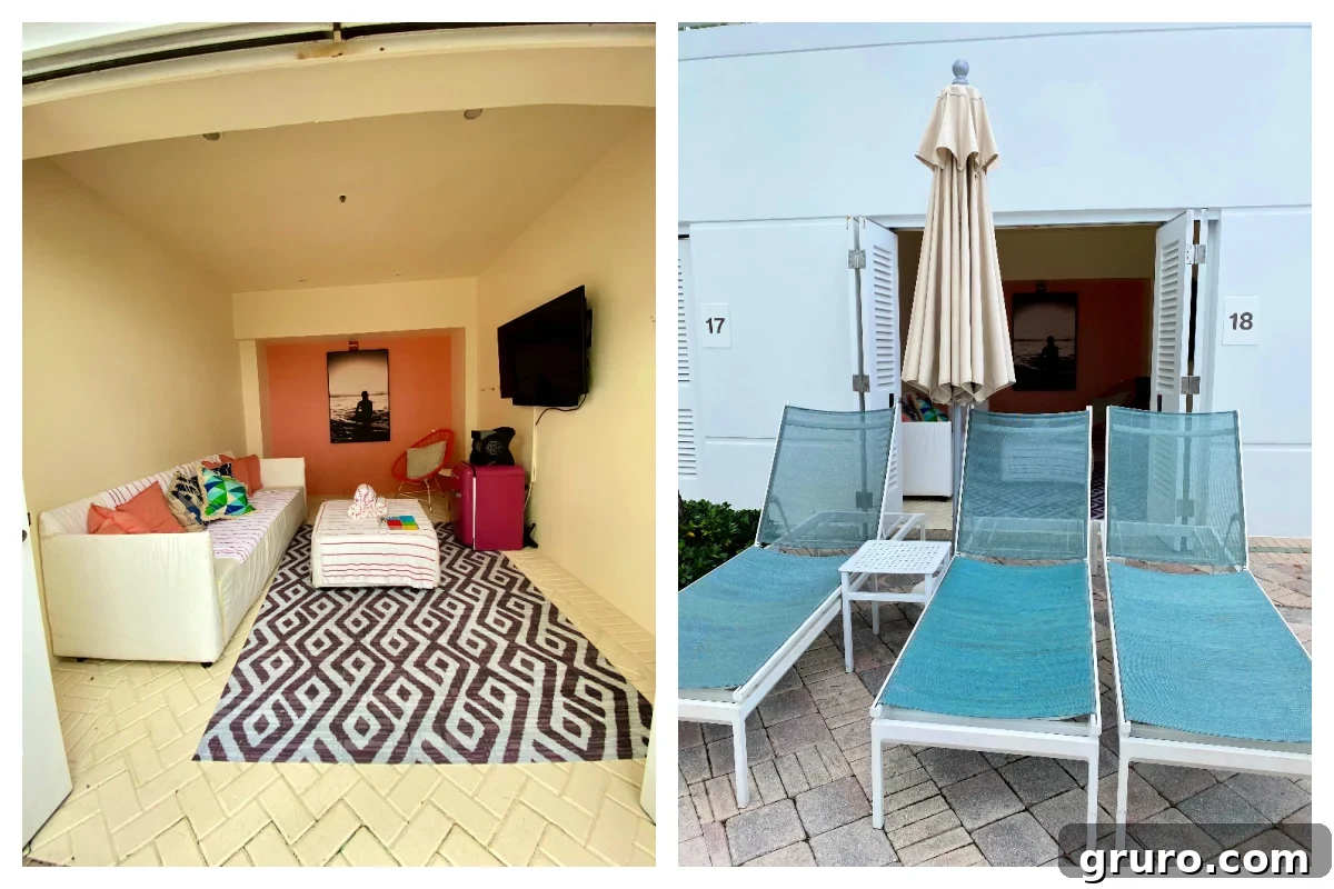 A luxurious poolside cabana featuring a comfortable couch, TV, and refrigerator, with inviting lounge chairs positioned directly in front.