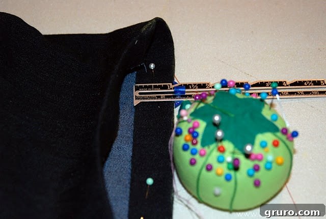 Folding and pinning the hemmed jeans