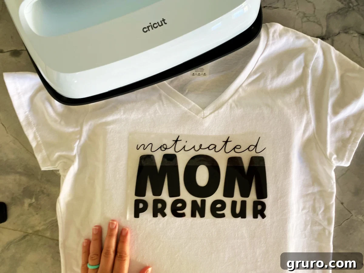 White shirt with motivated mompreuner on plastic on top.