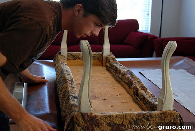 Bench before reupholstery, showing its original fabric and form.