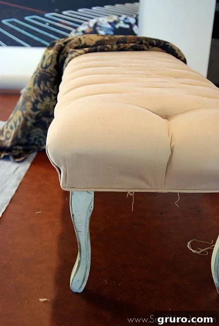 Bench partially stripped, revealing the beautiful tufted foundation beneath.