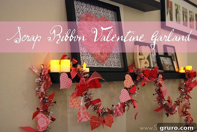 A beautifully decorated Valentine's garland adorned with ribbons and bows, displayed on a shelf alongside other festive Valentine's Day decor.