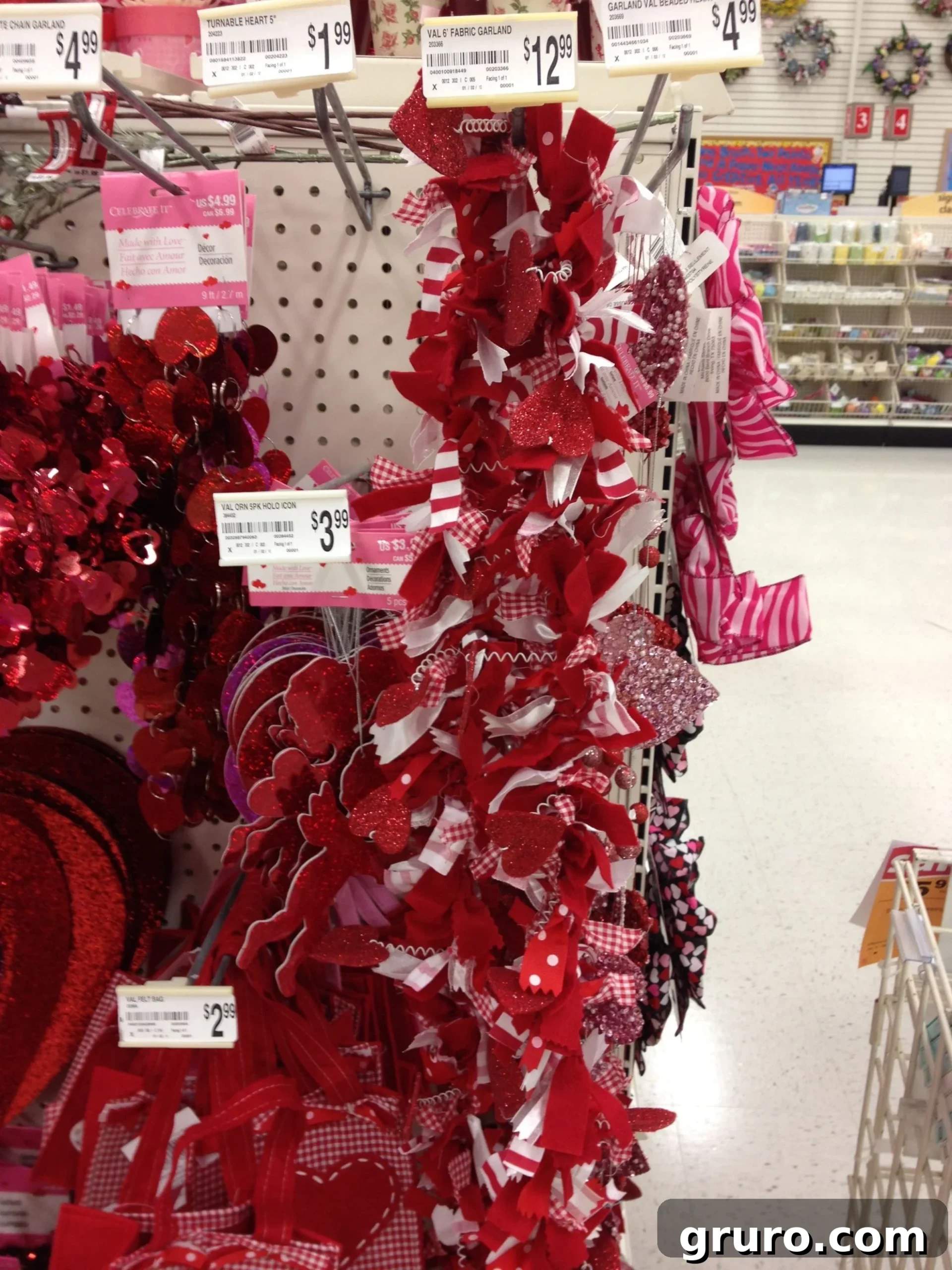 A vibrant display of Valentine's Day decorations at Michaels craft store, showcasing various garlands and festive items.