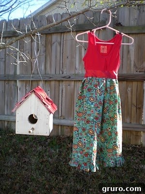 The finished upcycled paisley toddler dress, complete with a satin ribbon, ready to be worn.