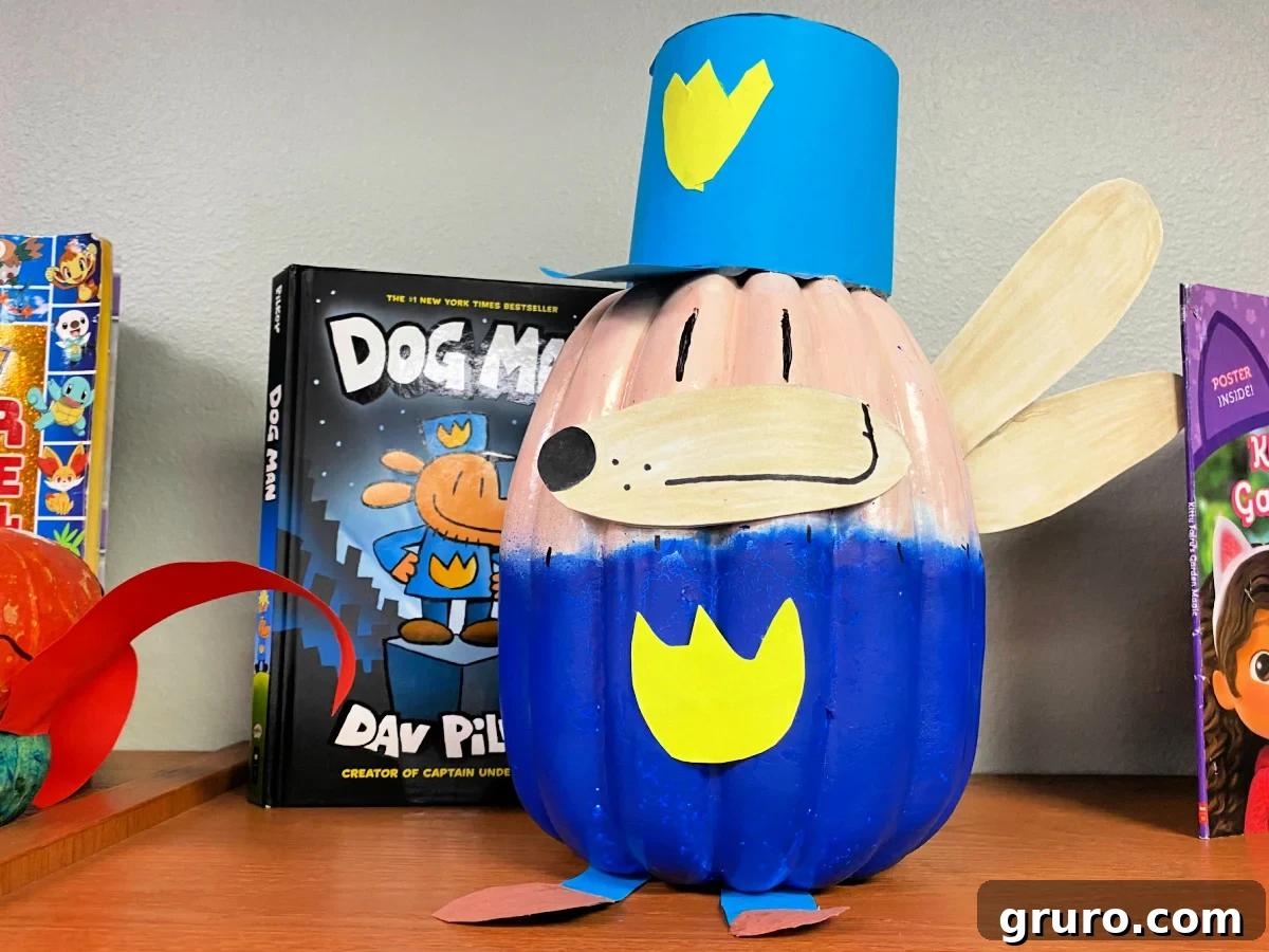 Dog Man pumpkin next to a Dog Man Book.