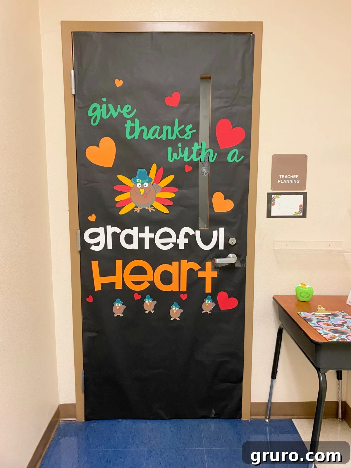 Black classroom door with a turkey and hearts.