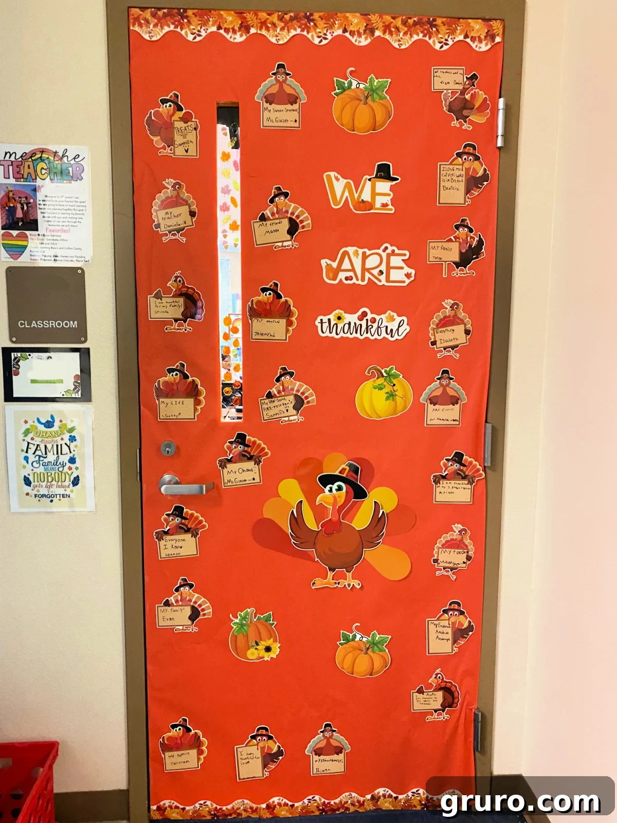 Orange classroom door with turkeys that say what they are thankful for.