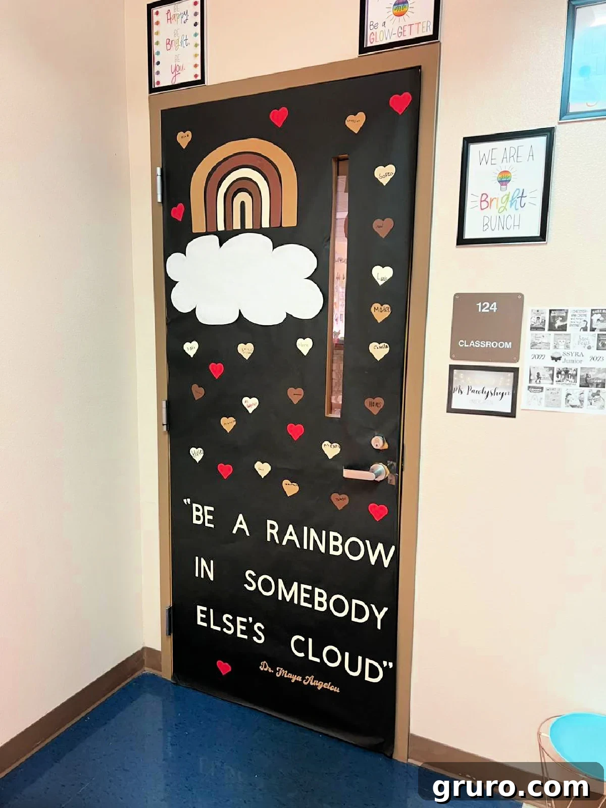 Black door with brown, cream, and red hearts with a Maya Angelou quote.