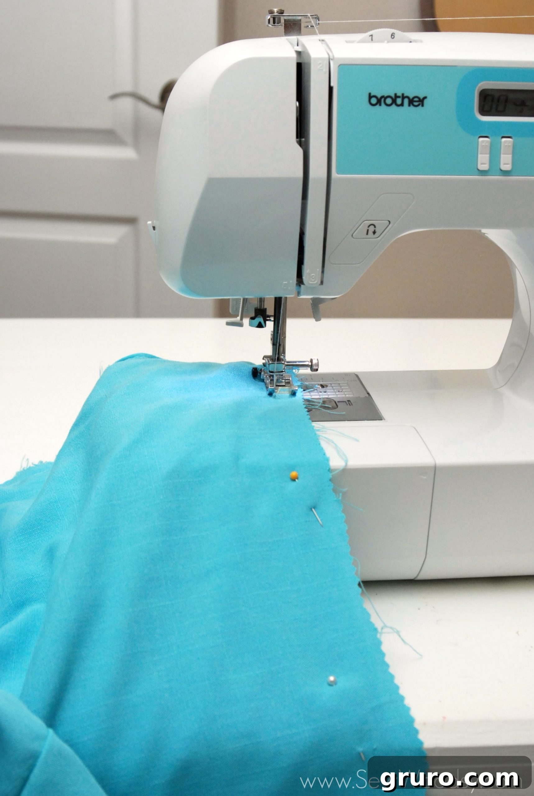 Pinning the three layers of fabric together for an envelope pillow cover before sewing.