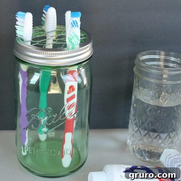 11 Genius Mason Jar Hacks 12 10 - The Country Chic Cottage - Mason Jar Toothbrush Holder