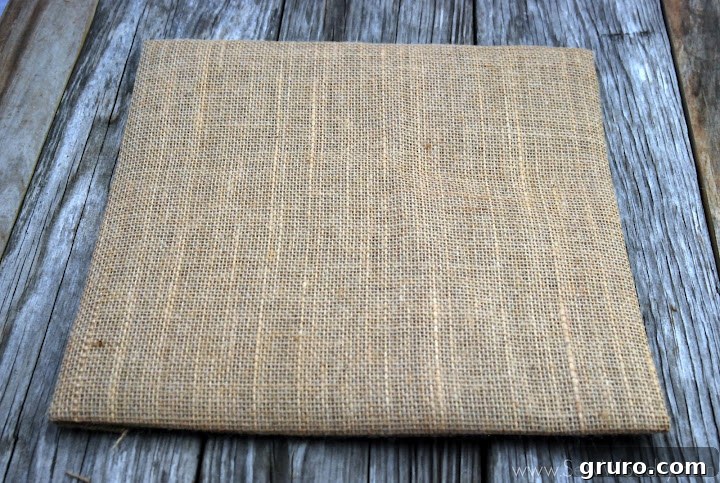 Gluing tan burlap around a piece of card stock