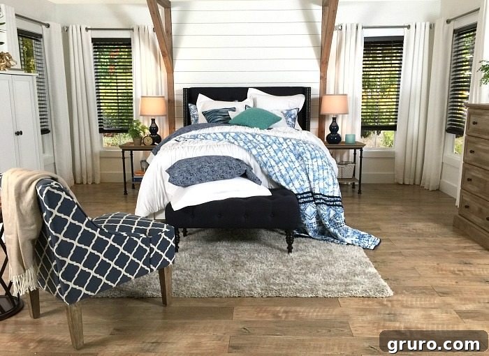 Close-up of the shiplap accent wall behind the bed in a Navy and White Farmhouse Bedroom, emphasizing rustic charm and elegant design at Refresh Restyle.