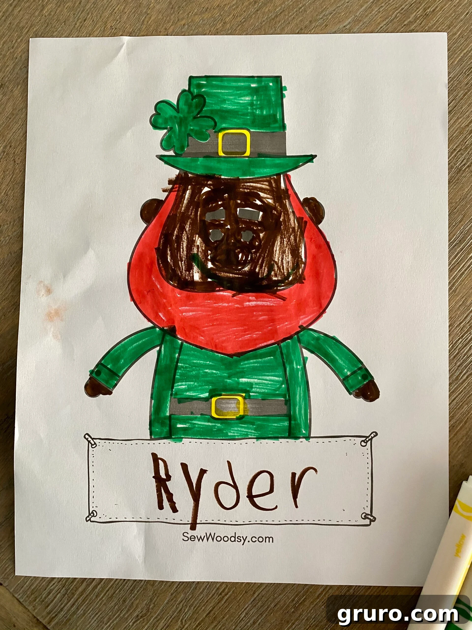 Colored leprechaun coloring sheet with childs name on paper, showcasing a vibrant completed page.