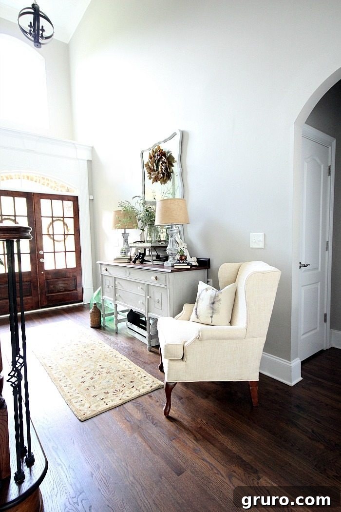 Painted lamp bases mirror and side board - love the light bright entry