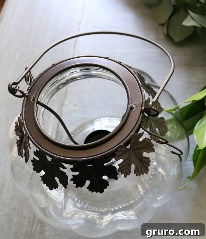 Autumn Glow Centerpiece 3 Clear glass pumpkin candle holder transformed into a vase for autumn flowers