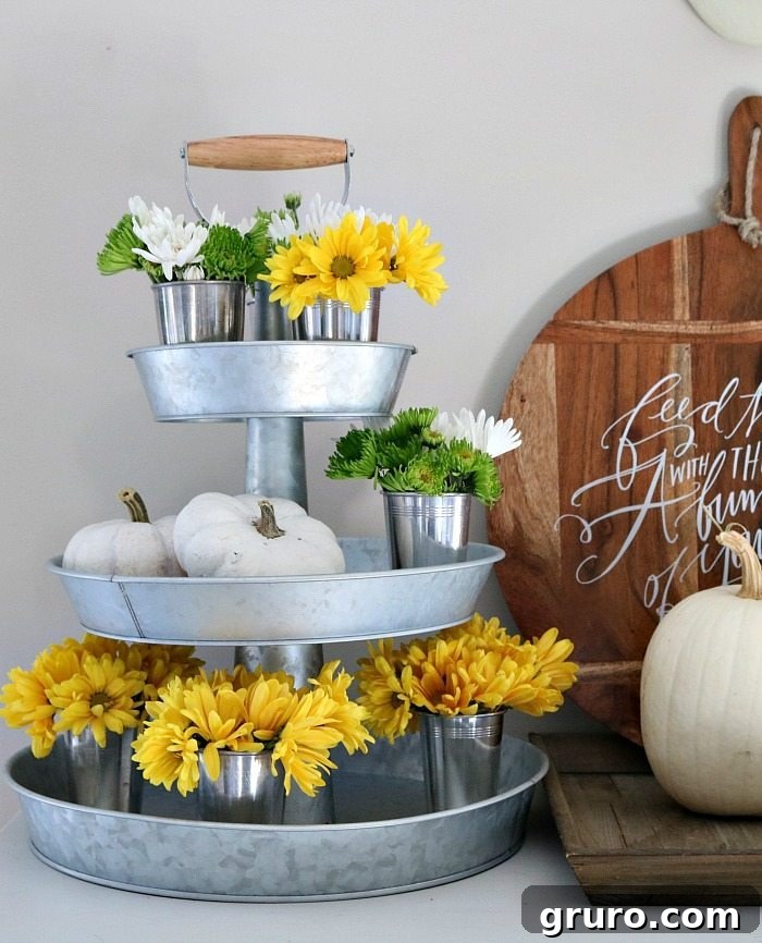 3-tiered galvanized server with fall mums and white pumpkins