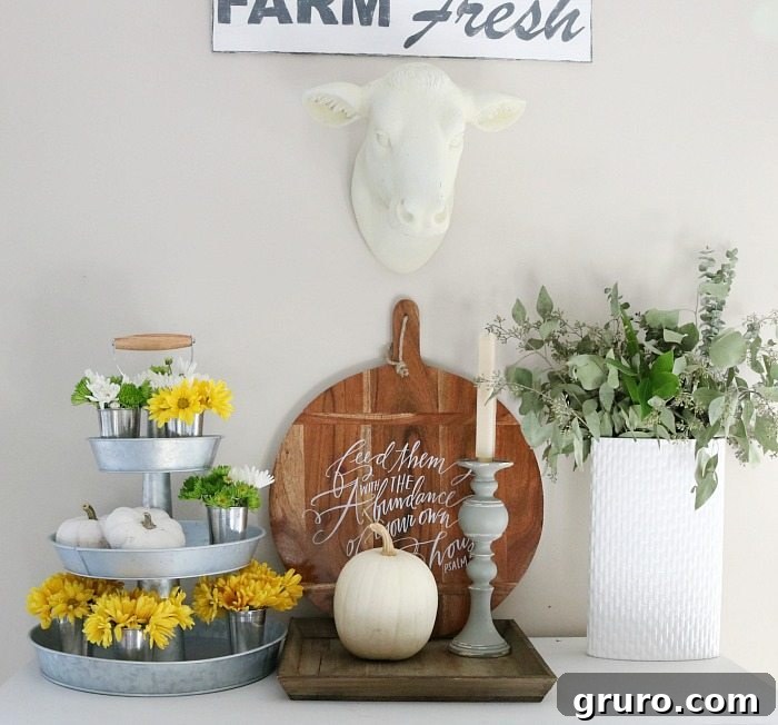 Farmhouse tiered serving stand with fall flowers and decor