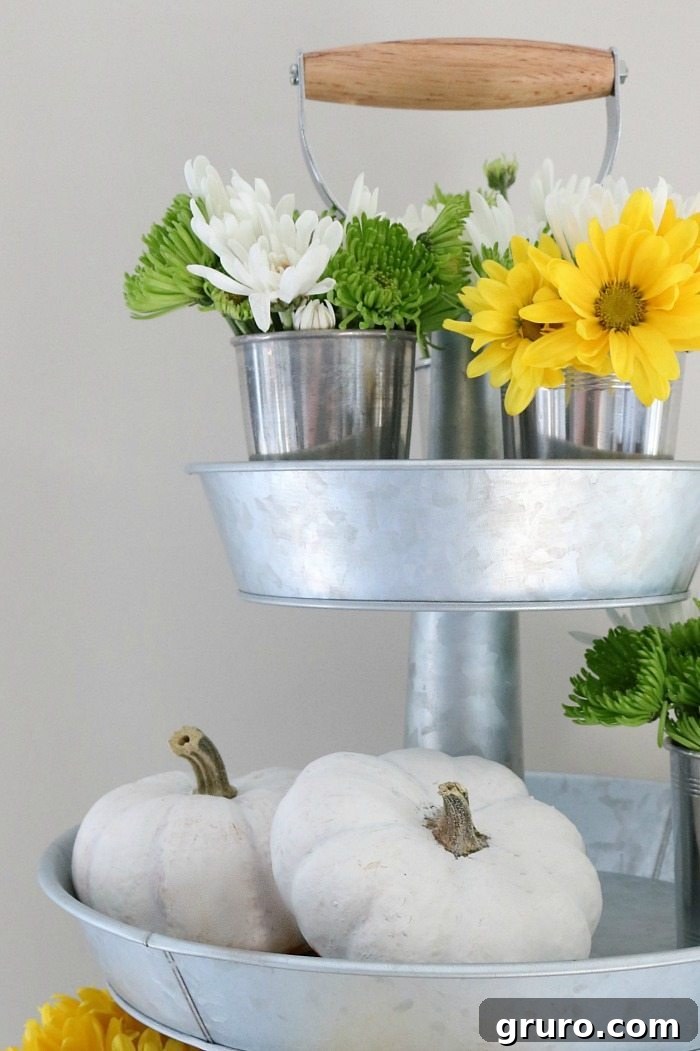 Galvanized stand with autumn flowers and pumpkins for storage and display