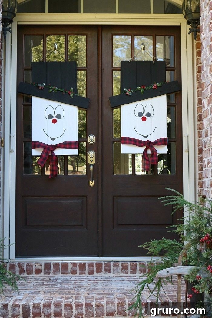 Full view of the reversible door hanger, showcasing both the winter snowman and fall scarecrow sides for versatile seasonal display.