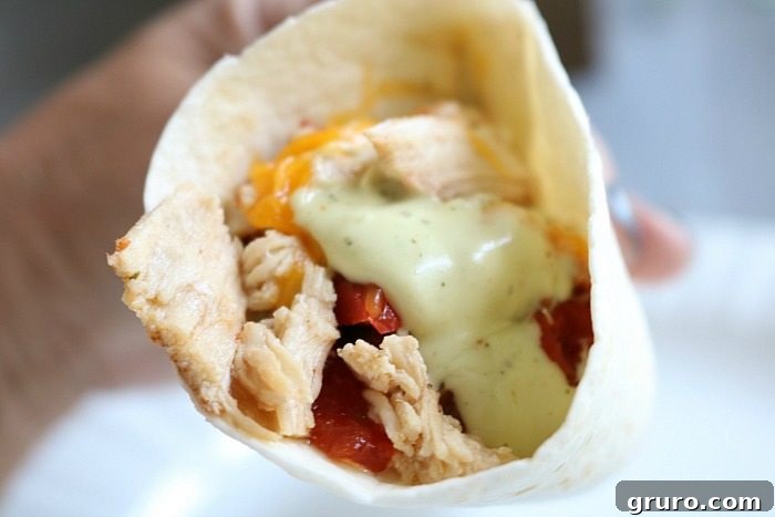 Close up of slow cooker chicken fajitas with avocado dressing
