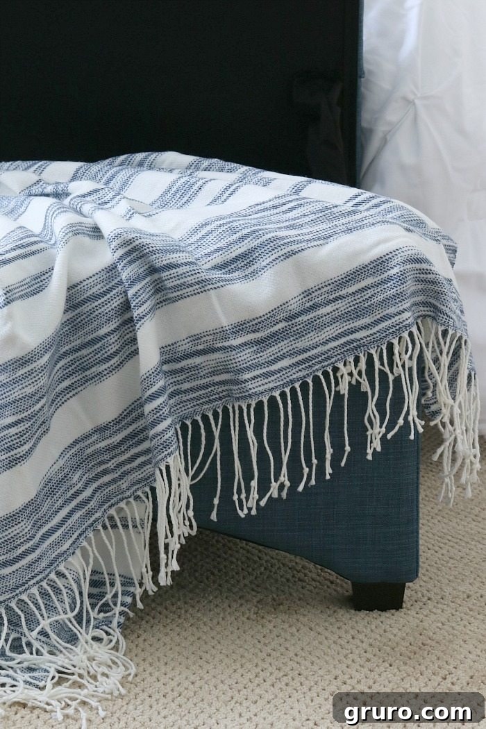 Indigo throw and storage bench in denim, tying the room's color scheme together.