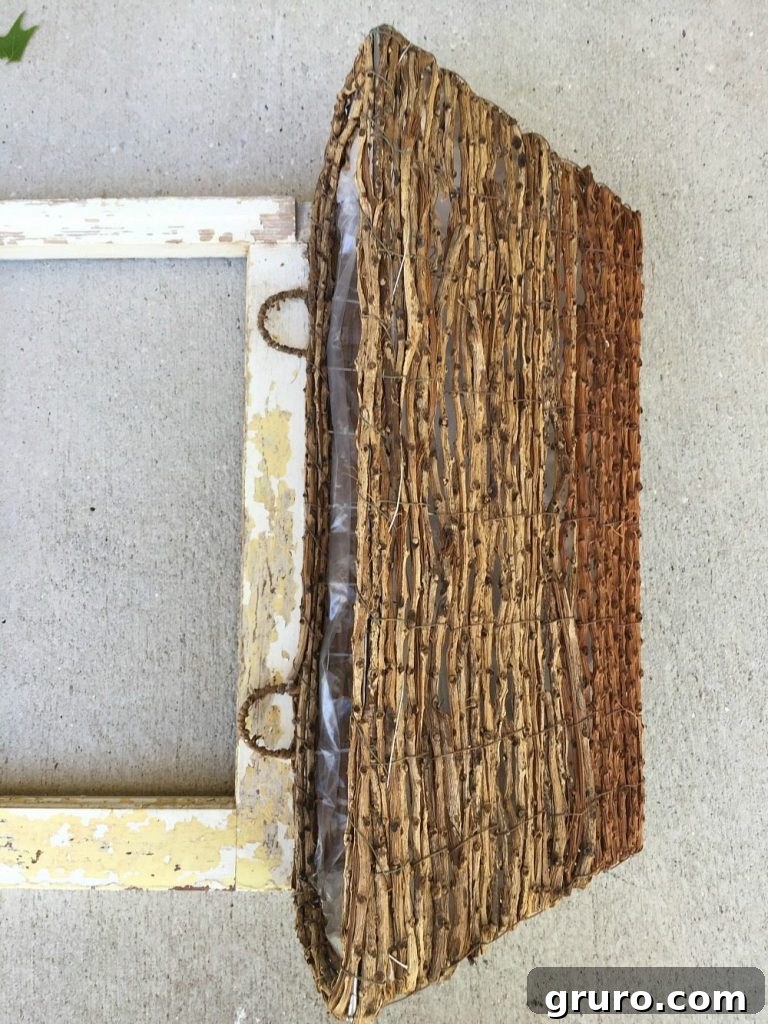 Precisely deciding the ideal hanging position for the window box basket on the vintage window frame.