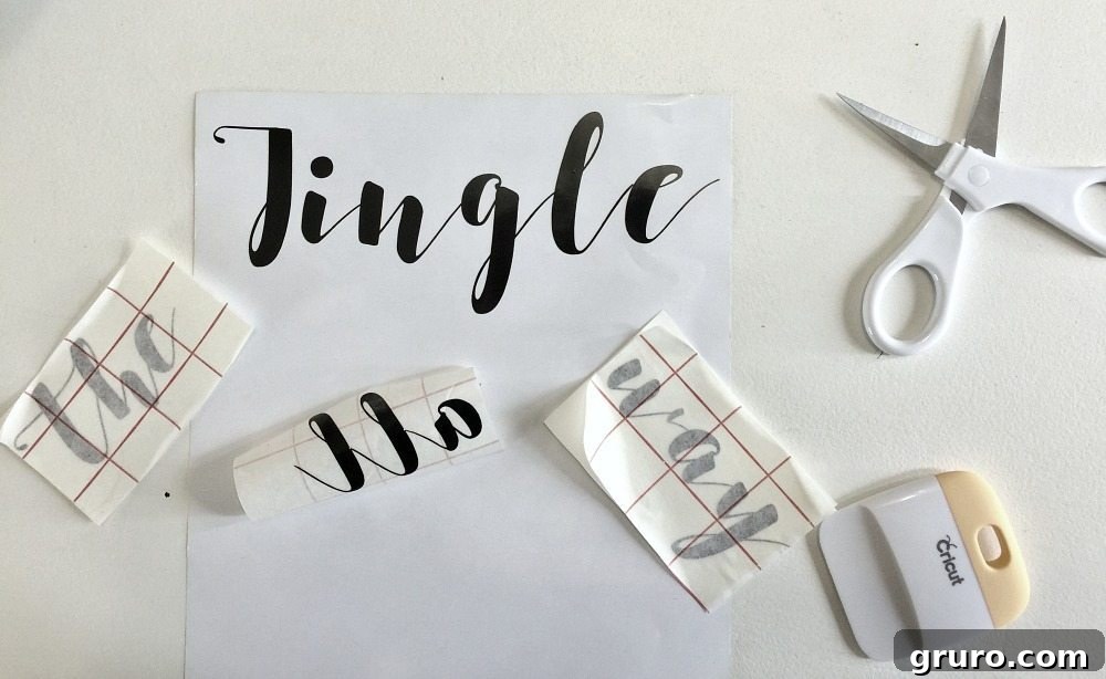 Using your Cricut cut the vinyl for the Christmas shadow box